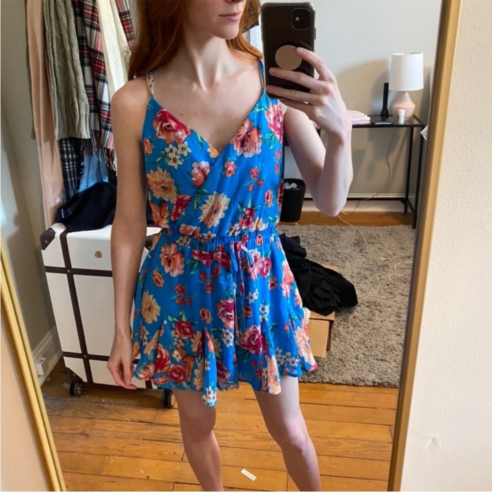 Francesca’s floral blue romper XXS NEW